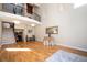 Spacious living room with hardwood floors, staircase, and natural light from large windows at 3290 Coachmans Ne Way, Roswell, GA 30075