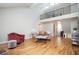Bright living room features hardwood floors, a fireplace, and an open floor plan at 3290 Coachmans Ne Way, Roswell, GA 30075