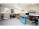 Comfortable office features carpet, natural light, shelving, and a dedicated workspace at 3290 Coachmans Ne Way, Roswell, GA 30075