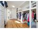 Bright and spacious walk-in closet features custom drawers and storage at 3290 Coachmans Ne Way, Roswell, GA 30075