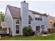 Spacious backyard featuring a patio with seating and a green lawn at 566 Lullingstone Se Dr, Marietta, GA 30067