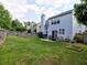 Lush backyard features a patio, perfect for entertaining, set against a backdrop of a wooden fence at 566 Lullingstone Se Dr, Marietta, GA 30067