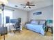 Cozy bedroom featuring a ceiling fan, a daybed and a desk with computer setup at 566 Lullingstone Se Dr, Marietta, GA 30067