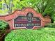 Welcoming brick sign for The Glens at Powers Ferry community amidst lush green landscaping at 566 Lullingstone Se Dr, Marietta, GA 30067