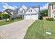Charming two-story home features a manicured lawn, a two-car garage and a welcoming front porch at 566 Lullingstone Se Dr, Marietta, GA 30067