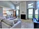Bright living room with high ceilings, fireplace and seamless flow into the adjacent kitchen, perfect for modern living at 566 Lullingstone Se Dr, Marietta, GA 30067