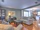 Comfortable living area with hardwood floors open to the kitchen, great for modern living at 566 Lullingstone Se Dr, Marietta, GA 30067