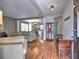 Open-concept living room with hardwood floors that connect seamlessly to the kitchen, great for entertaining at 566 Lullingstone Se Dr, Marietta, GA 30067