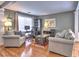 Spacious living area with hardwood flooring, comfortable seating, and ample natural light at 566 Lullingstone Se Dr, Marietta, GA 30067