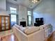 Bright living room with large windows, fireplace, and a comfortable sofa at 566 Lullingstone Se Dr, Marietta, GA 30067
