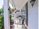 Cozy front porch with outdoor seating, hanging plants, and stylish lighting, great for relaxing at 566 Lullingstone Se Dr, Marietta, GA 30067