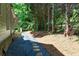 Backyard featuring a stone pathway and professional landscaping at 580 Cliftwood Ct, Sandy Springs, GA 30328