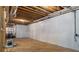 Unfinished basement showcasing open ceiling, concrete floor and partially drywalled walls at 580 Cliftwood Ct, Sandy Springs, GA 30328