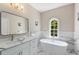 Elegant bathroom featuring a freestanding tub, marble accents, and a modern vanity at 580 Cliftwood Ct, Sandy Springs, GA 30328