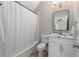 Clean bathroom with shower/tub combo, vanity, toilet, and modern fixtures at 580 Cliftwood Ct, Sandy Springs, GA 30328