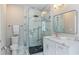 Modern bathroom with a marble shower, vanity, and contemporary fixtures at 580 Cliftwood Ct, Sandy Springs, GA 30328