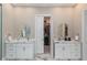 Bathroom featuring double sinks and a walk-in closet at 580 Cliftwood Ct, Sandy Springs, GA 30328