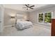 Comfortable bedroom with a large window and neutral décor, ideal for restful nights at 580 Cliftwood Ct, Sandy Springs, GA 30328