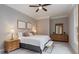 Spacious bedroom includes a ceiling fan, dresser, nightstands, lamps, and a comfortable bed and linens at 580 Cliftwood Ct, Sandy Springs, GA 30328