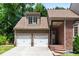 Beautiful home with a two-car garage and brick accents offering a perfect blend of style and functionality at 580 Cliftwood Ct, Sandy Springs, GA 30328
