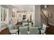 Bright kitchen, glass dining table, and staircase at 580 Cliftwood Ct, Sandy Springs, GA 30328