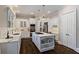 Bright kitchen features white cabinets and an island at 580 Cliftwood Ct, Sandy Springs, GA 30328