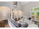 Open-concept living room with soaring ceilings and staircase at 580 Cliftwood Ct, Sandy Springs, GA 30328