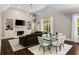 Open-concept living room with fireplace and dining area at 580 Cliftwood Ct, Sandy Springs, GA 30328