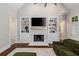 Open-concept living room with fireplace and built-ins at 580 Cliftwood Ct, Sandy Springs, GA 30328