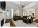Open-concept living room features fireplace and kitchen at 580 Cliftwood Ct, Sandy Springs, GA 30328