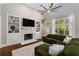Open-concept living room with fireplace and built-ins at 580 Cliftwood Ct, Sandy Springs, GA 30328