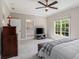 Spacious bedroom featuring a ceiling fan and natural light from a large window at 580 Cliftwood Ct, Sandy Springs, GA 30328