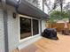 Home back deck featuring a sliding glass door entry, a grill and outdoor dining, perfect for entertaining at 910 Oriole Se Ln, Marietta, GA 30067