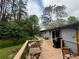 Large wooden deck in a lush backyard setting at 910 Oriole Se Ln, Marietta, GA 30067