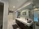 Modern bathroom features walk-in shower, double sink and closet space at 910 Oriole Se Ln, Marietta, GA 30067