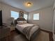 Bedroom with a queen-size bed, wood floors, and natural light at 910 Oriole Se Ln, Marietta, GA 30067