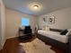 Bedroom with hardwood floors, a desk, and a stylish daybed at 910 Oriole Se Ln, Marietta, GA 30067