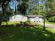 Charming single-story home with a well-maintained lawn and mature trees, offering great curb appeal at 910 Oriole Se Ln, Marietta, GA 30067