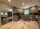 Bright kitchen with stainless steel appliances, gray cabinets, and stylish marble floors at 910 Oriole Se Ln, Marietta, GA 30067