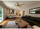 Open-concept living room with hardwood floors, comfortable seating, and access to the outdoor area at 910 Oriole Se Ln, Marietta, GA 30067