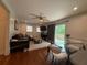 Cozy living room with hardwood floors, a modern ceiling fan, and a sliding glass door to the outdoor area at 910 Oriole Se Ln, Marietta, GA 30067