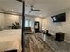 Large main bedroom with a four-poster bed, workspace, and views from the bay window at 910 Oriole Se Ln, Marietta, GA 30067