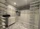 Walk-in closet with marble floors and wire shelving system at 910 Oriole Se Ln, Marietta, GA 30067