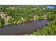 Panoramic aerial shot of a stunning lakefront property surrounded by mature trees providing ultimate privacy at 1240 Bridgewater Walk, Snellville, GA 30078