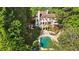 Stunning aerial view of the backyard with a pool, hot tub, and lush landscaping at 1240 Bridgewater Walk, Snellville, GA 30078
