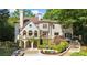Back exterior elevation showing a backyard, balcony, and landscaped yard at 1240 Bridgewater Walk, Snellville, GA 30078