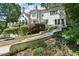 Landscaped backyard featuring a multilevel patio and verdant foliage at 1240 Bridgewater Walk, Snellville, GA 30078