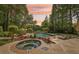 Backyard oasis featuring a pool, hot tub, well manicured landscaping, and lake views at 1240 Bridgewater Walk, Snellville, GA 30078
