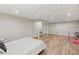 Spacious finished basement with modern flooring, providing ample area for various activities at 1240 Bridgewater Walk, Snellville, GA 30078