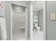 Bathroom with tiled shower, toilet, and cabinet for storage at 1240 Bridgewater Walk, Snellville, GA 30078